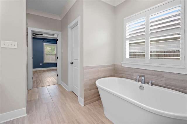 72421 Homestead St, Covington, LA 70435 - full bathroom featuring a freestanding bath and baseboards