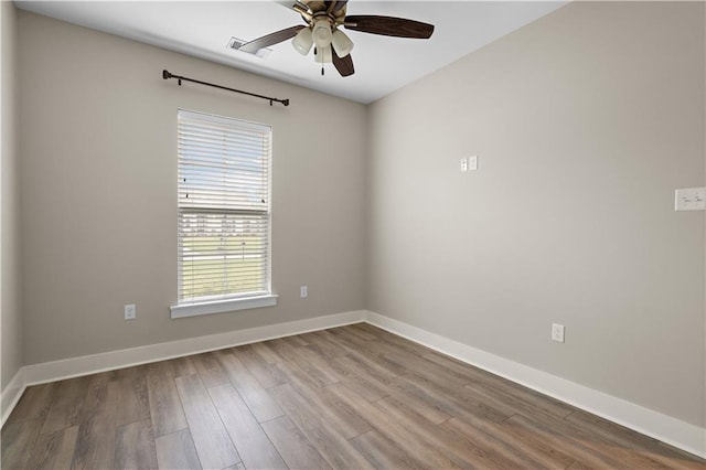 72421 Homestead St, Covington, LA 70435 - spare room with ceiling fan, baseboards, wood finished floors, and visible vents