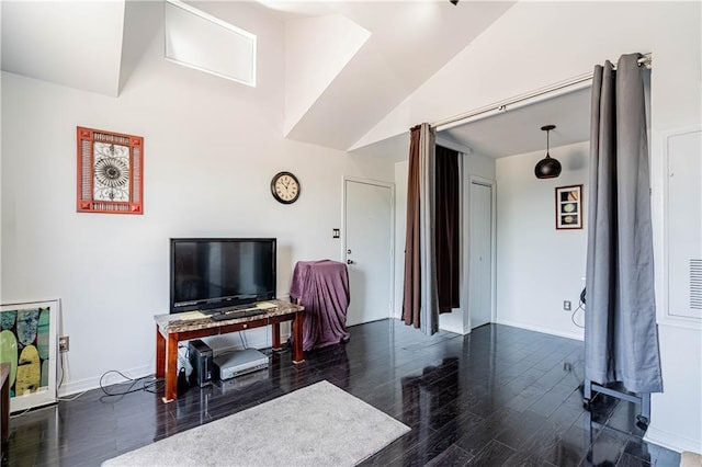 living room with dark wood-style flooring and baseboards