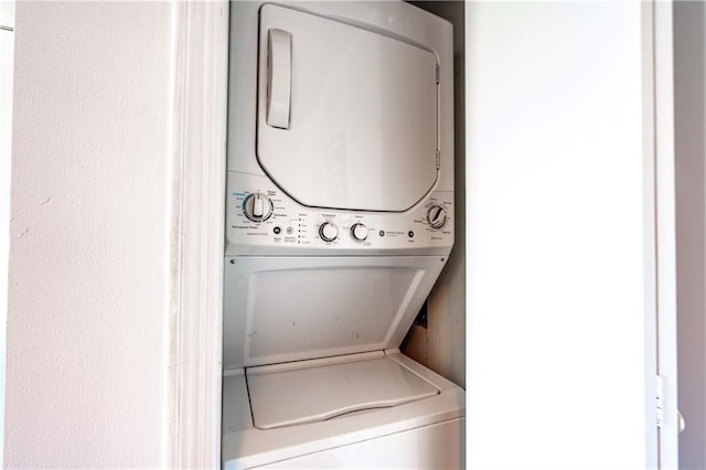 laundry room with laundry area and stacked washer / drying machine