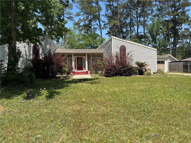 view of front of house with a garage and a front yard
