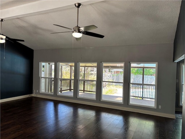 unfurnished room with baseboards, a wealth of natural light, and ceiling fan