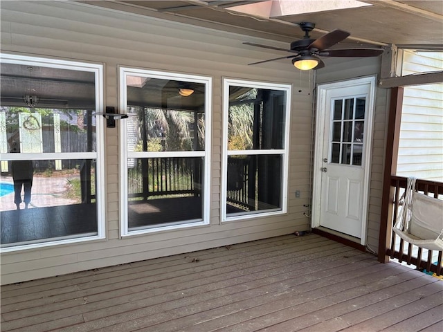wooden deck with ceiling fan