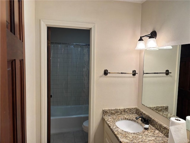 bathroom featuring tile patterned floors, vanity, and toilet