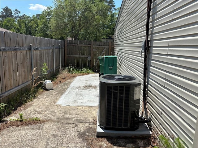 details featuring a fenced backyard and central air condition unit