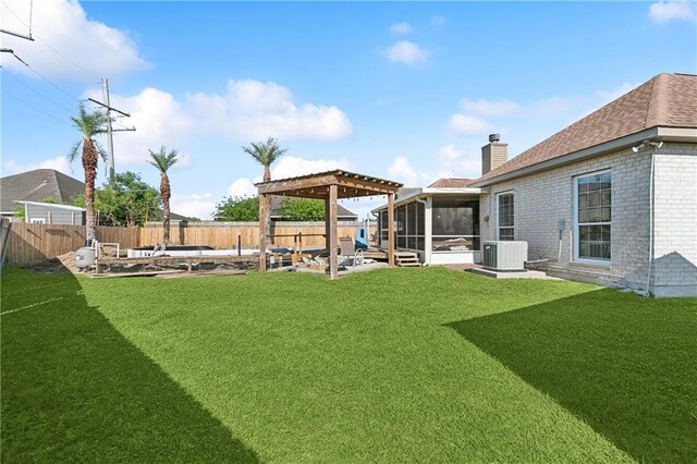 view of yard with cooling unit, a sunroom, a patio, and a fenced backyard