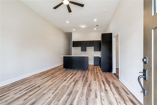 150301 N Rocheblave St, New Orleans, LA 70119 - unfurnished living room with a ceiling fan, light wood-type flooring, baseboards, and recessed lighting