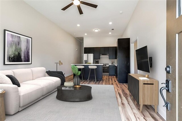 150301 N Rocheblave St, New Orleans, LA 70119 - unfurnished living room featuring ceiling fan, light wood-style flooring, baseboards, and recessed lighting
