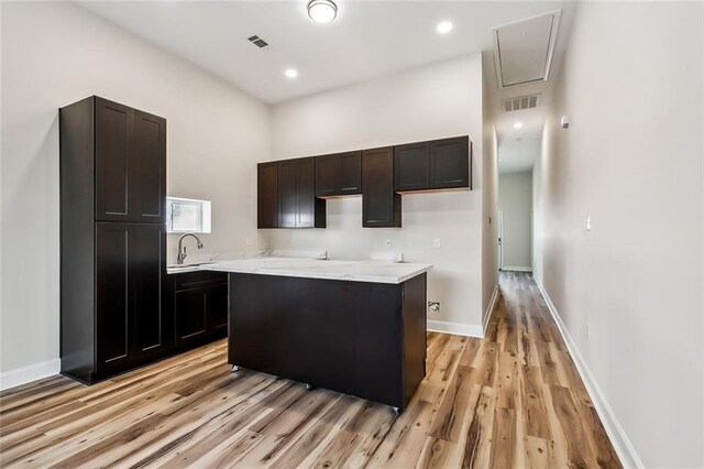 150301 N Rocheblave St, New Orleans, LA 70119 - bedroom featuring wood finished floors, ensuite bath, and baseboards