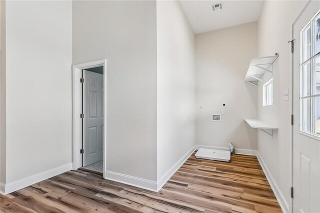 150301 N Rocheblave St, New Orleans, LA 70119 - unfurnished bedroom featuring wood finished floors, baseboards, a closet, a high ceiling, and a ceiling fan