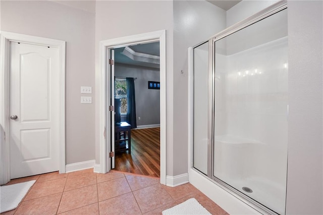 2436 Cours Carson St, Mandeville, LA 70448 - bathroom featuring baseboards, a shower stall, and tile patterned flooring