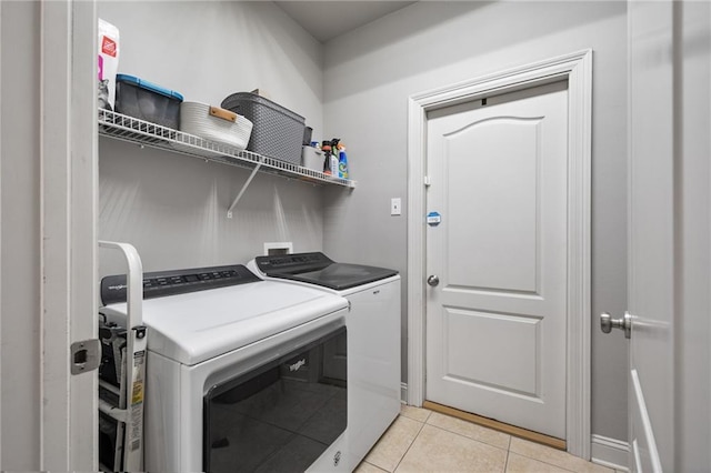 2436 Cours Carson St, Mandeville, LA 70448 - laundry room with washing machine and clothes dryer and light tile patterned flooring