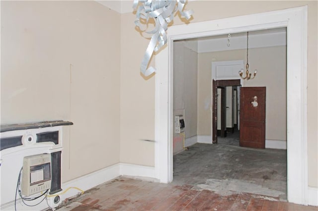 interior space with heating unit and a notable chandelier