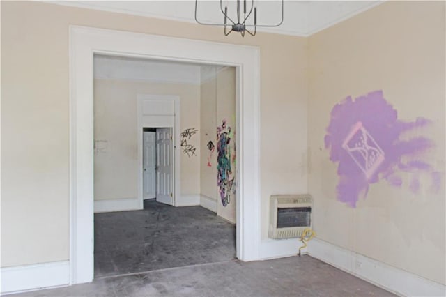 corridor featuring heating unit and an inviting chandelier