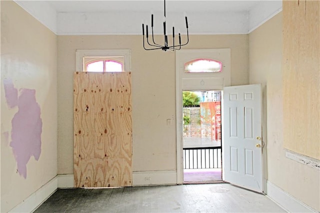 foyer entrance featuring a notable chandelier