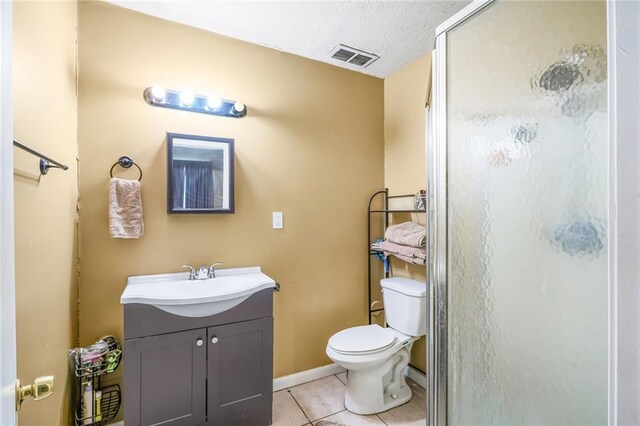 1208 Maine Ave, Kenner, LA 70062 - full bathroom with vanity, a shower stall, toilet, tile patterned flooring, and baseboards