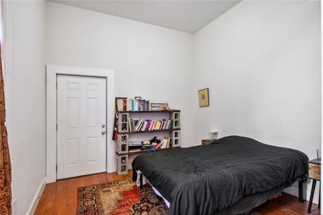 264545 Saint Ann St, New Orleans, LA 70119 - bedroom with baseboards and wood finished floors