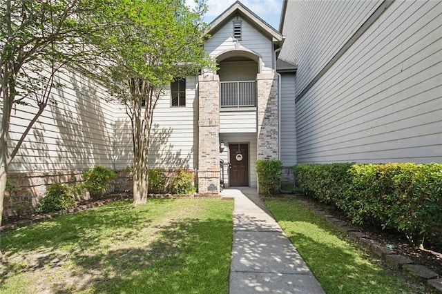 350 Emerald Forest Blvd Unit 9102, Covington, LA 70433 - doorway to property featuring a lawn