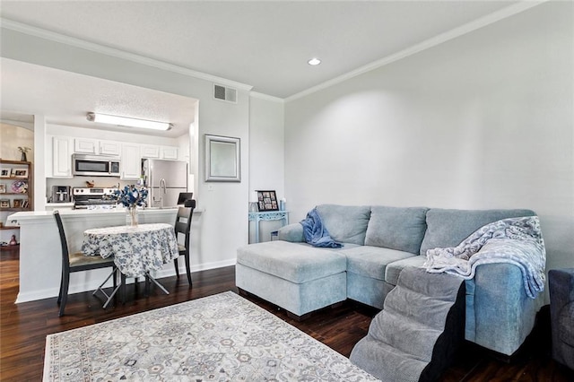 350 Emerald Forest Blvd Unit 9102, Covington, LA 70433 - living area with ornamental molding, dark wood-style flooring, and visible vents