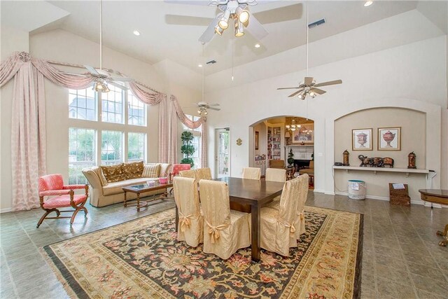 350 Emerald Forest Blvd Unit 9102, Covington, LA 70433 - dining space featuring arched walkways, high vaulted ceiling, ceiling fan, and recessed lighting