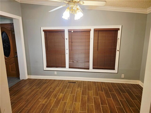 4967A Jean Lafitte Blvd, Lafitte, LA 70067 - spare room featuring ceiling fan, baseboards, dark wood-style flooring, and ornamental molding