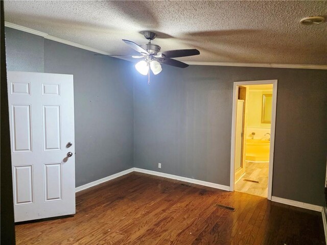 4967A Jean Lafitte Blvd, Lafitte, LA 70067 - spare room with crown molding, wood finished floors, ceiling fan, a textured ceiling, and baseboards