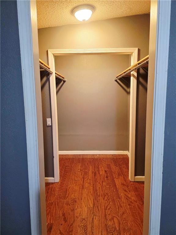 4967A Jean Lafitte Blvd, Lafitte, LA 70067 - walk in closet with wood finished floors