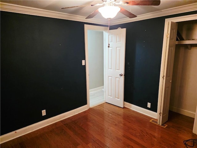 4967A Jean Lafitte Blvd, Lafitte, LA 70067 - unfurnished bedroom featuring wood finished floors, baseboards, crown molding, ceiling fan, and a closet