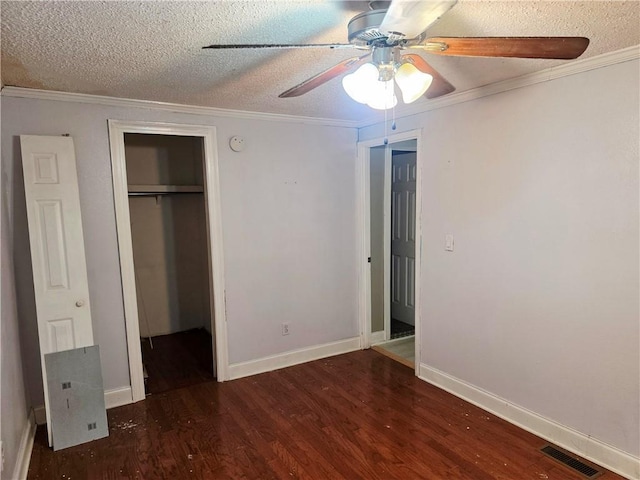 4967A Jean Lafitte Blvd, Lafitte, LA 70067 - unfurnished bedroom with wood finished floors, a textured ceiling, baseboards, crown molding, and a ceiling fan