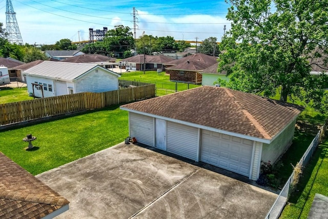 detached garage featuring fence