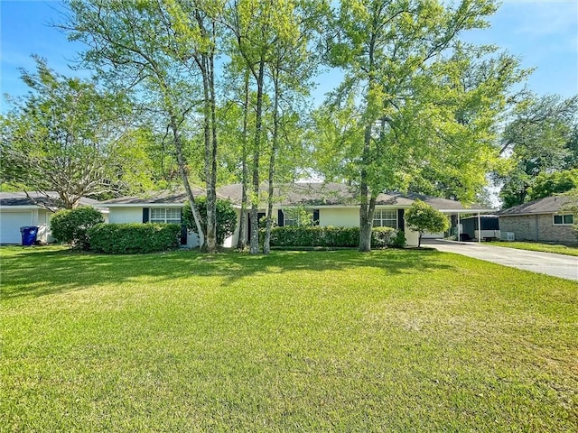 305 Country Club Blvd, Slidell, LA 70458 - single story home featuring a carport, a front lawn, and concrete driveway
