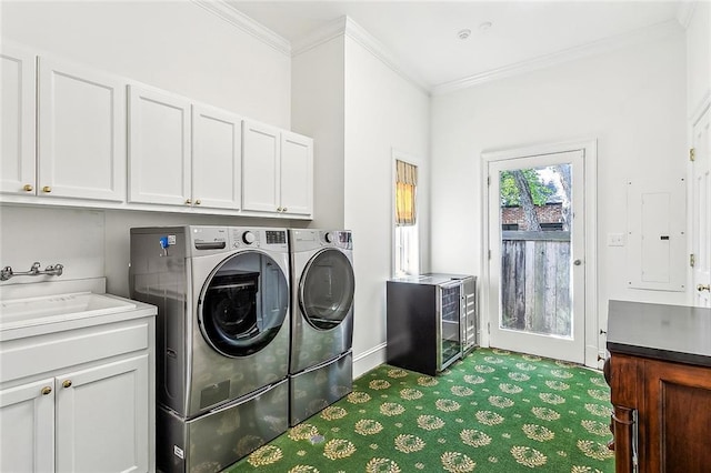 10005 Sauve Oak Ln, River Ridge, LA 70123 - washroom with washing machine and dryer, electric panel, carpet flooring, and ornamental molding