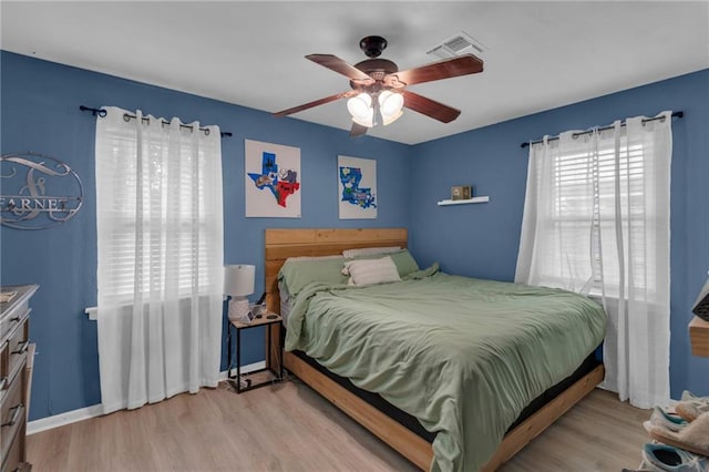 bedroom featuring wood finished floors and ceiling fan