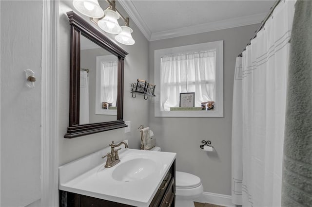 full bath featuring healthy amount of natural light, vanity, toilet, and ornamental molding