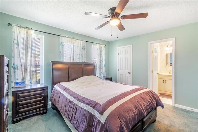 429 Bertolino Dr, Kenner, LA 70065 - bedroom with carpet, ensuite bath, baseboards, a textured ceiling, and ceiling fan