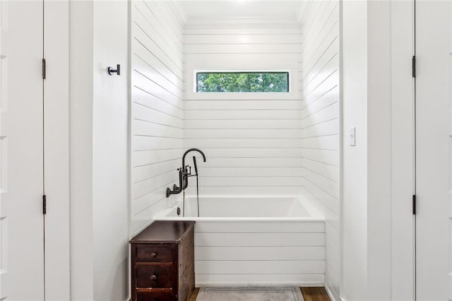 full bathroom with crown molding and a bathing tub