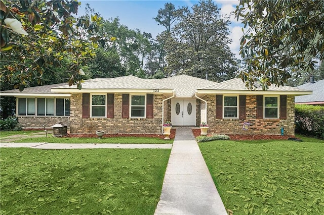 123 Robinhood Rd, Covington, LA 70433 - single story home featuring a shingled roof, brick siding, and a front yard