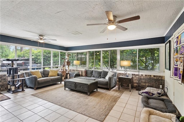 123 Robinhood Rd, Covington, LA 70433 - sunroom with tile patterned floors, ceiling fan, and an outdoor living space