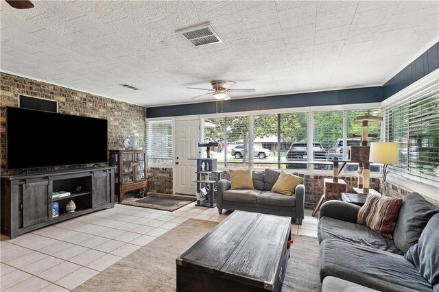 123 Robinhood Rd, Covington, LA 70433 - living area featuring a ceiling fan, visible vents, and light tile patterned floors