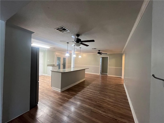 123 Robinhood Rd, Covington, LA 70433 - unfurnished room with crown molding, ceiling fan, dark wood-style flooring, baseboards, and a textured ceiling
