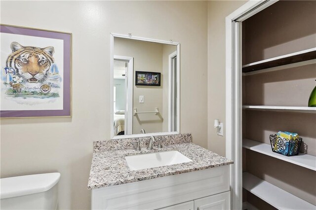 123 Robinhood Rd, Covington, LA 70433 - half bath featuring vanity and toilet