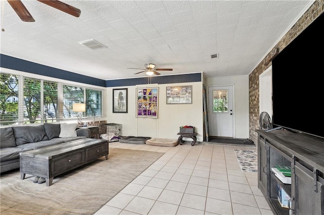 123 Robinhood Rd, Covington, LA 70433 - living area featuring a ceiling fan, healthy amount of natural light, and light tile patterned floors