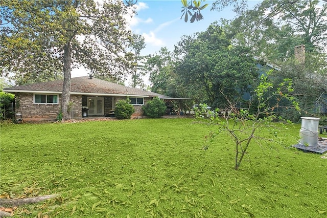 123 Robinhood Rd, Covington, LA 70433 - view of grassy yard featuring french doors