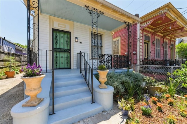 2426 Chippewa St, New Orleans, LA 70130 - doorway to property with covered porch and fence