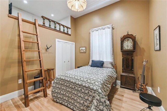 2426 Chippewa St, New Orleans, LA 70130 - bedroom featuring wood finished floors, baseboards, and a closet
