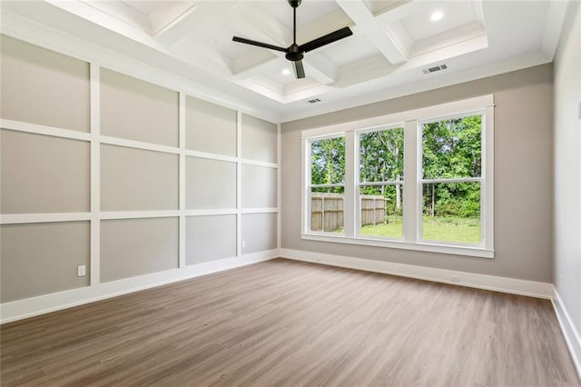 unfurnished room with baseboards, visible vents, coffered ceiling, wood finished floors, and ceiling fan