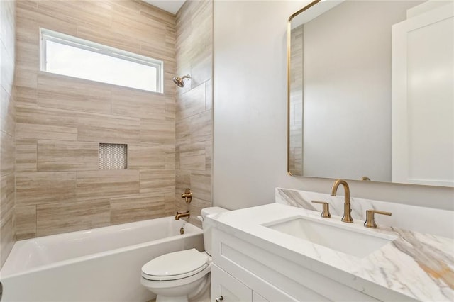 bathroom featuring toilet, vanity, and  shower combination