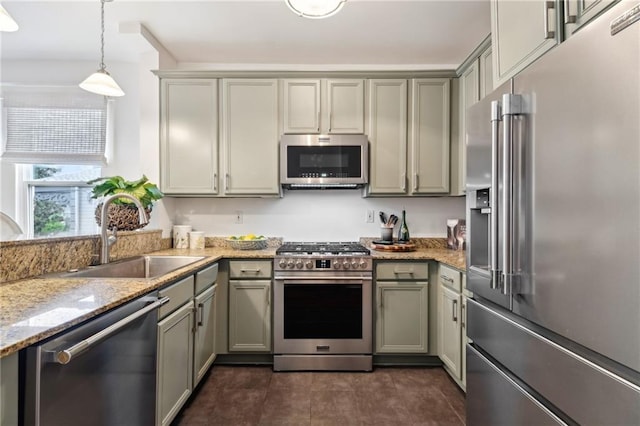 370507 Laurel St, New Orleans, LA 70115 - kitchen with a sink, pendant lighting, gray cabinets, light stone countertops, and appliances with stainless steel finishes