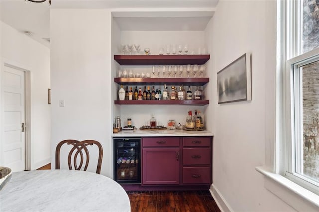 370507 Laurel St, New Orleans, LA 70115 - bar featuring a dry bar, baseboards, beverage cooler, and dark wood-type flooring