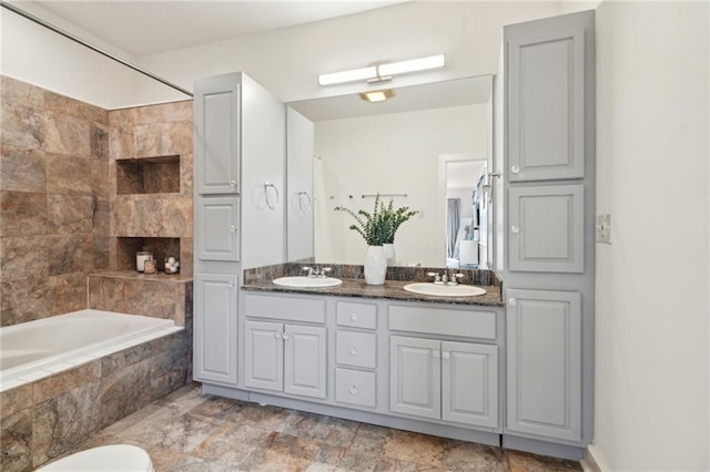 370507 Laurel St, New Orleans, LA 70115 - bathroom featuring tiled shower / bath combo, a sink, and double vanity